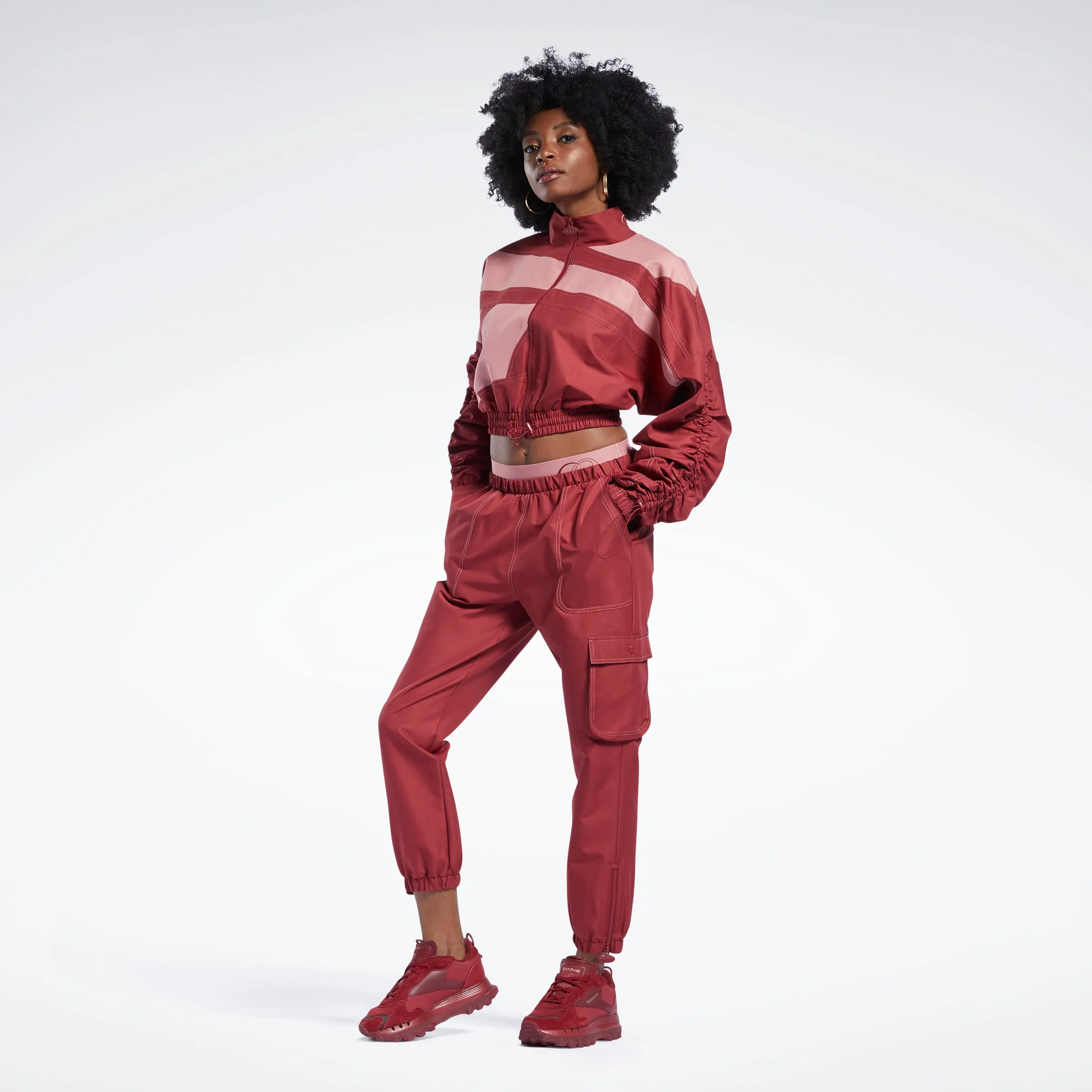 Reebok Apparel Women Cardi B Woven Satin Track Top Trired